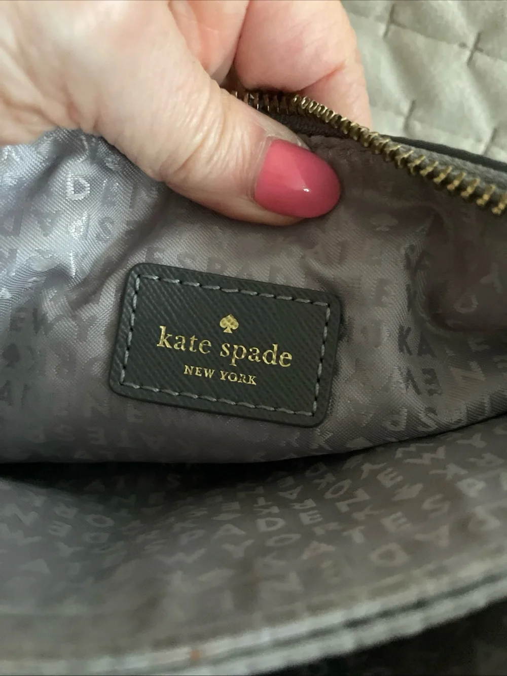kate spade gray nylon crossbody with gold logo plaque